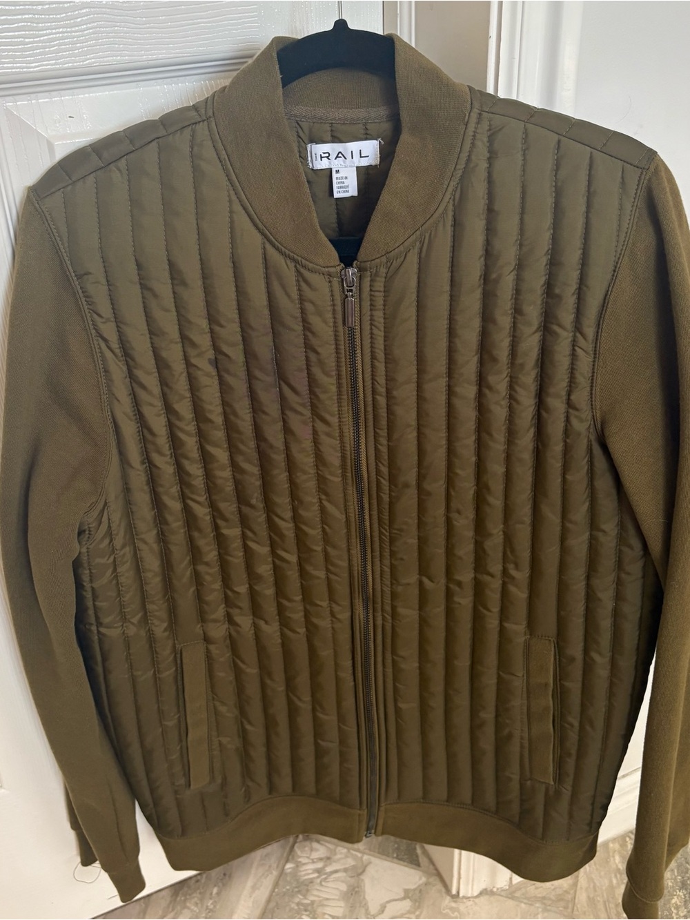 Men’s olive green quilted zip-up bomber jacket by The Rail.